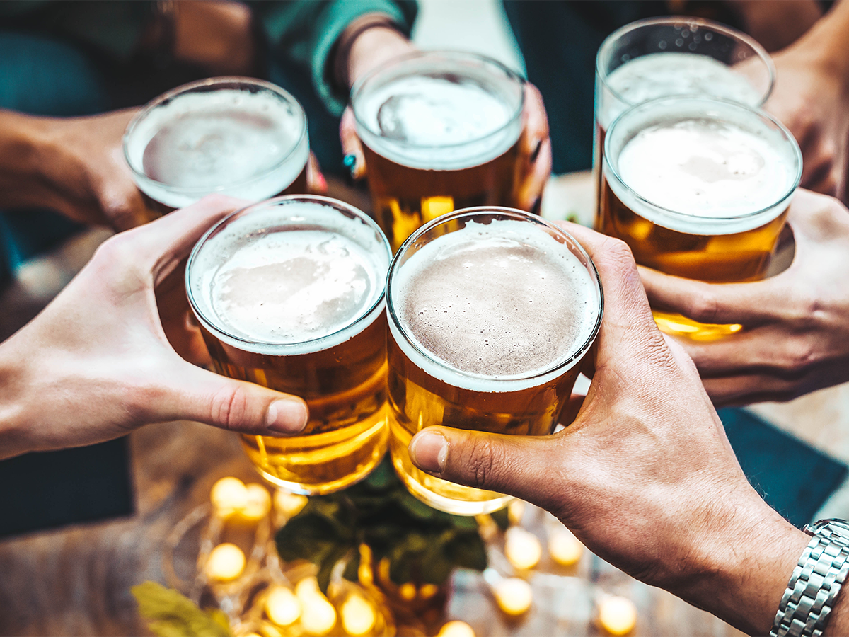 group of friends cheers beers